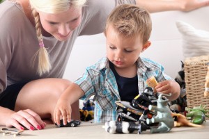 Child with ASD playing with toys